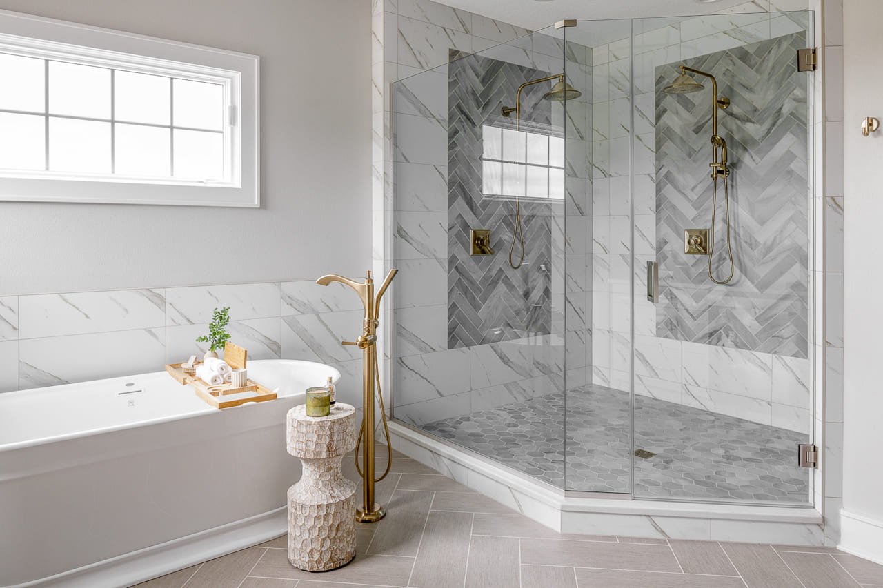 Beautiful Walk-in Shower with Glass Surround and Standing Tub | Compelling Homes Remodeling + Design