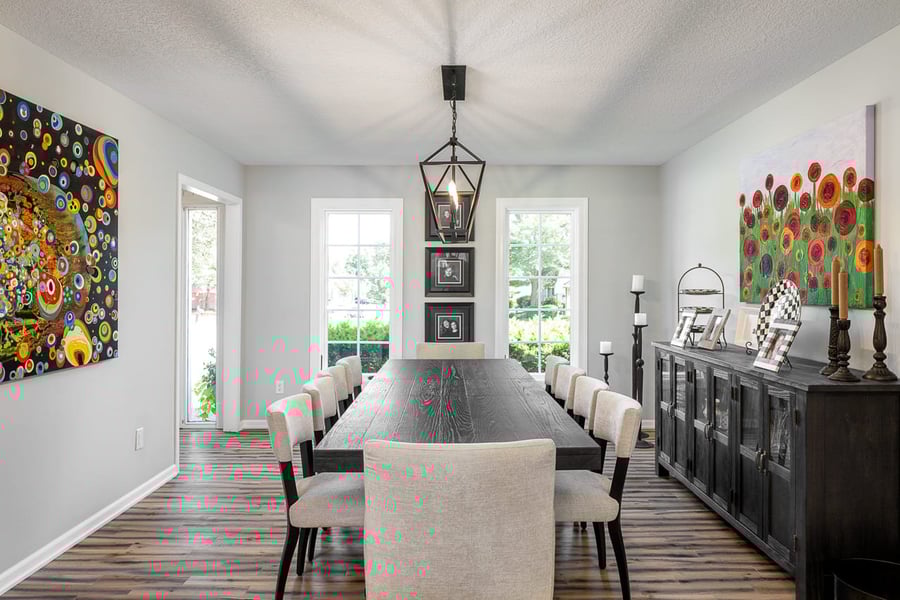 Large Dining Area with Barnwood-esque Farmhouse Flooring and Industrial Lighting | Compelling Homes