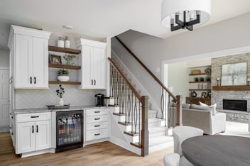Living Room With A Stairway Connecting To Upper Deck | Compelling Homes