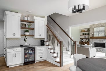 Living Room With A Stairway Connecting To Upper Deck | Compelling Homes