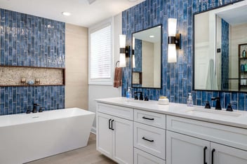 Luxury bathroom with beautiful blue tiles used to line the walls.