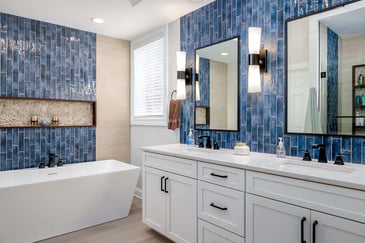Luxury bathroom with beautiful blue tiles used to line the walls.
