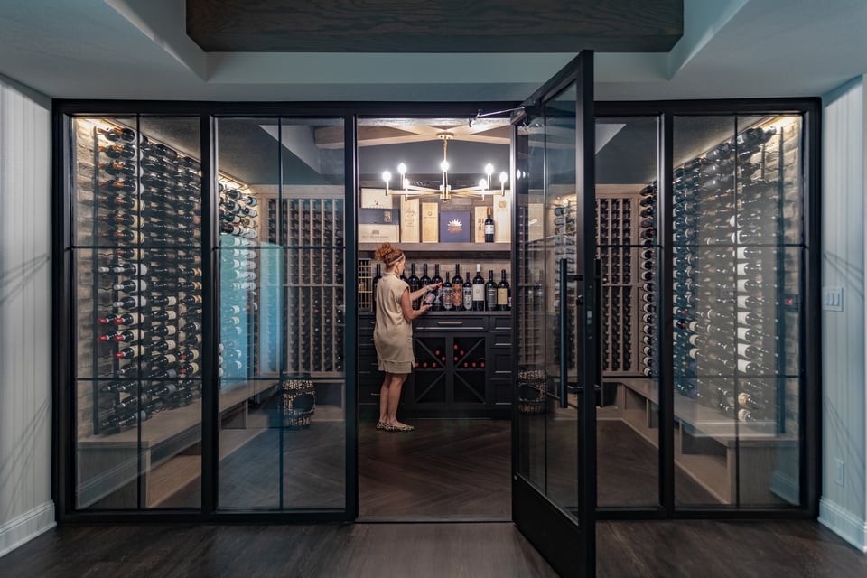 a wine cellar in a modern basement bar