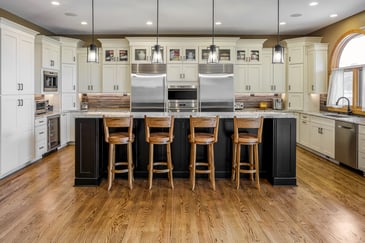 renovated kitchen with bar stools