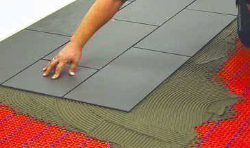 Electric heated floor been plastered by concrete and tiles