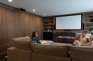 Women sitting on home theater seats