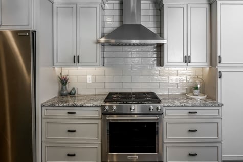 Kitchen Remodel with Subway Tile and Granite Countertops Modern Drawer Pulls Custom Cabinetry around Hood Vent | Compelling Homes