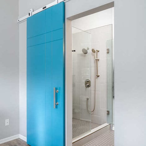 Full-Home Remodel Bedroom with Turquoise Sliding Door into Modern Bathroom and Walk-In Closet