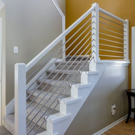 Full-Home Remodel Yellow Accent Wall with Modern Conduit Railing