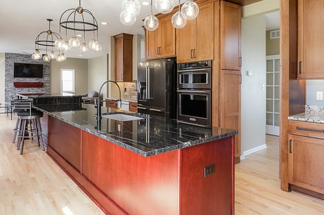 Home Remodel Open Floor Plan with Eat-In Island and Hidden Cabinet Door to Hallway