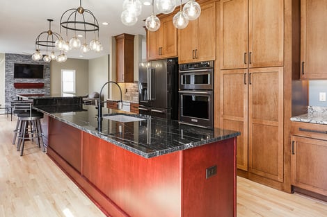 Home Remodel Open Floor Plan with Eat-In Island and Hidden Cabinet Door