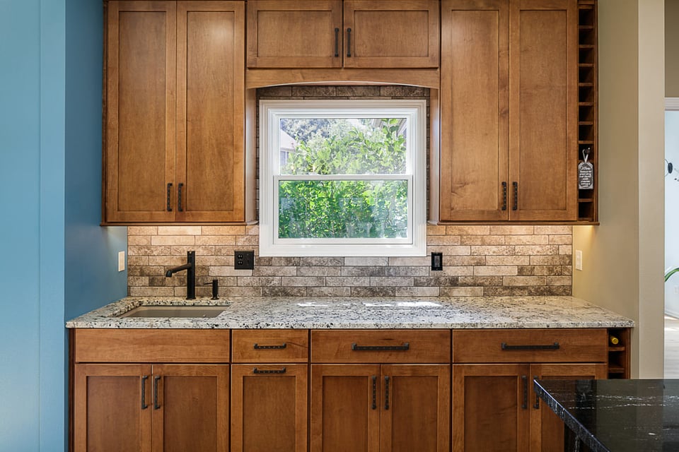 Kitchen Remodel Wooden Cabinets Stone Countertop and Backsplash