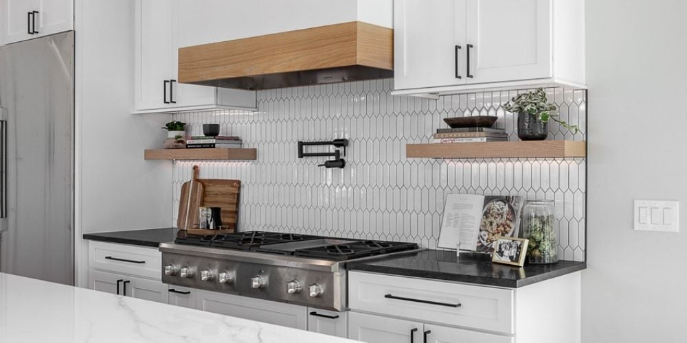 Modern Farmhouse Kitchen Remodel with White Geo-Backsplash, Pot Filler, and Oak Accents | Compelling Homes Design-Build Remodelers - Des Moines, IA