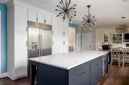 Full White Cabinetry Surrounding Fridge and Unique Kitchen Lighting | Compelling Homes