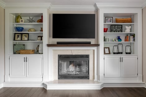 Main Living Room with White Built-in Shelves and Gorgeous Fireplace | Compelling Homes