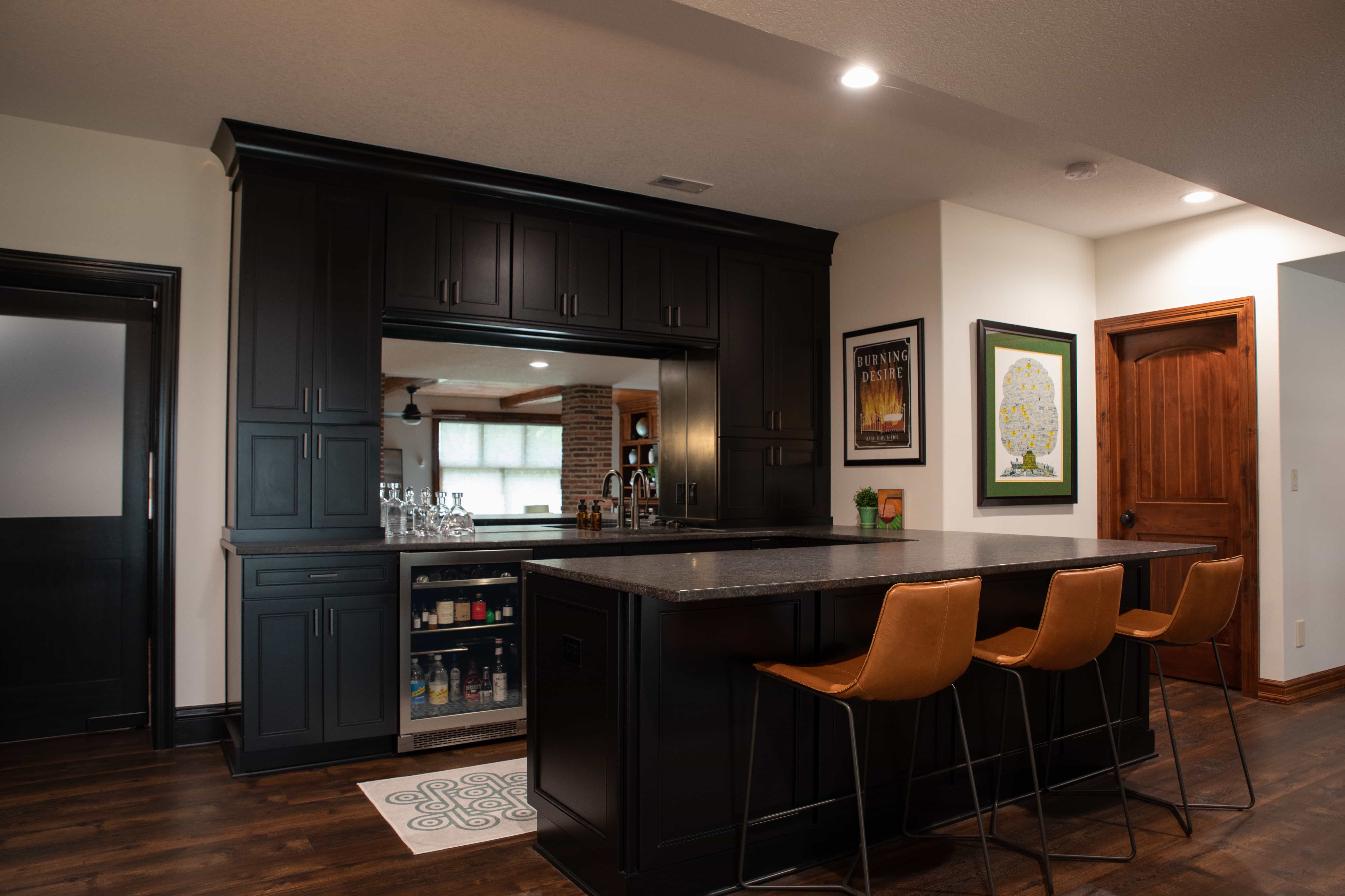 Bar section made with black-plated woods and marble countertop