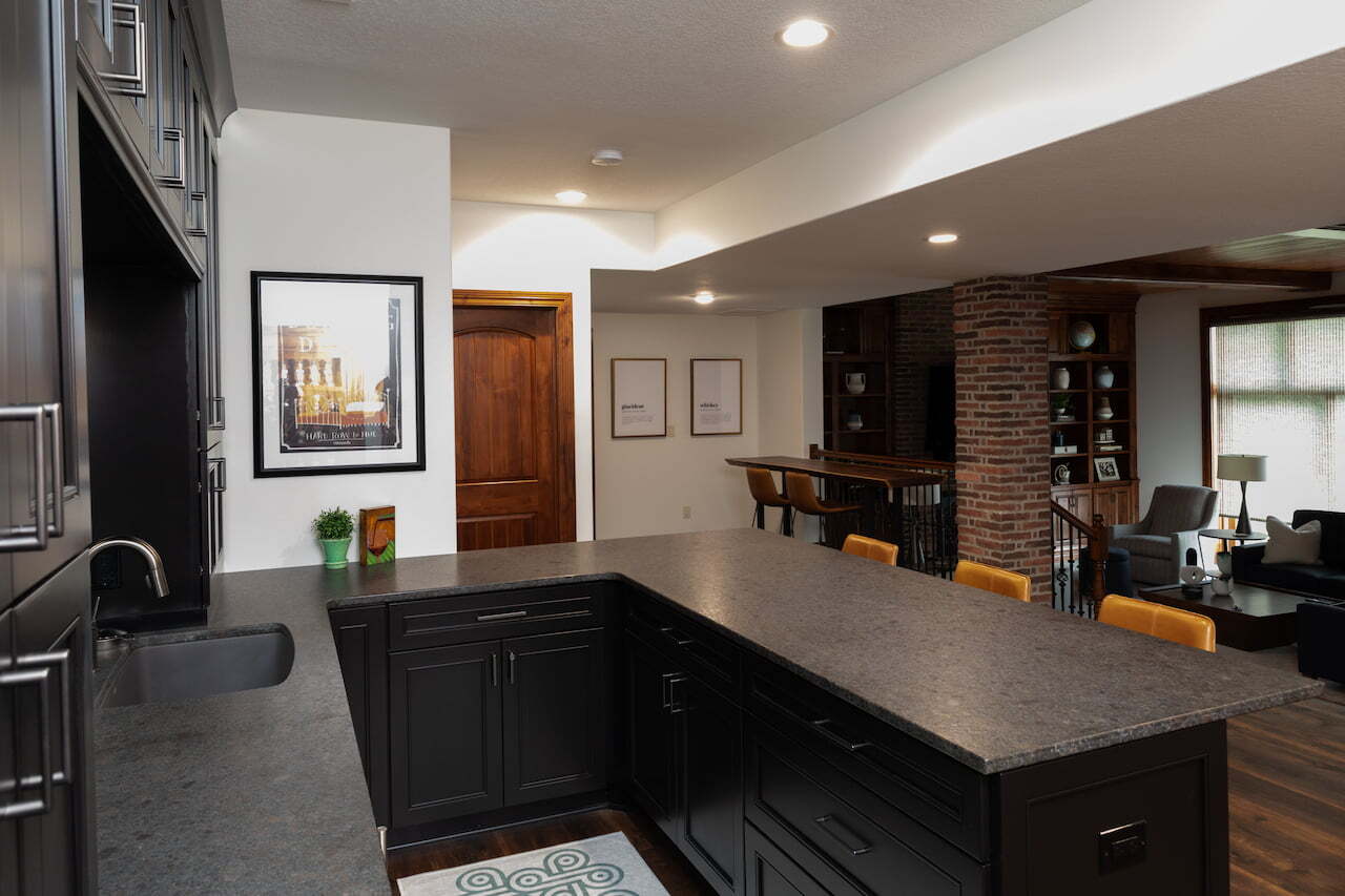 Full view of marble countertop of a basement bar remodeled by Compelling Homes