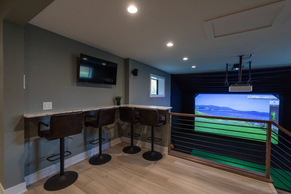Viewing area in a game room with bar stools