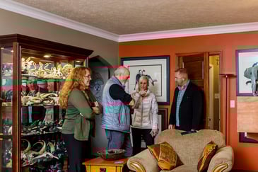 Compelling Homes team talking with homeowners