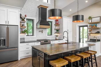 Luxe kitchen with pendant lightning done by the Des Moines kitchen remodeler Compelling Homes