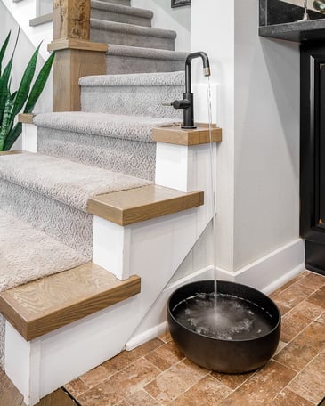 A Special Spigot Attached to a Stairs to Refill a Dog's Water Bowl | by Compelling Homes