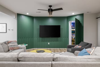 A remodeled basement in Des Moines featuring a secret door to a hidden game room