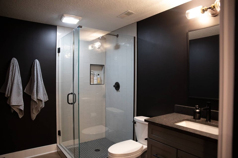 Refind and Functional Basement Bath with walk-in shower and toilet