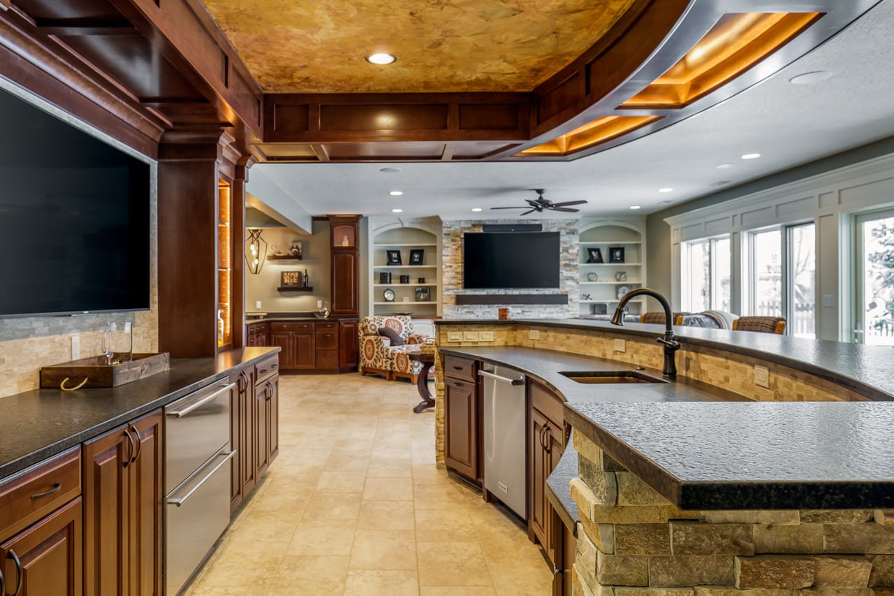 Basement Oasis with Massive Wrap-Around Bar with Prep Sink, Appliances, and Living Area