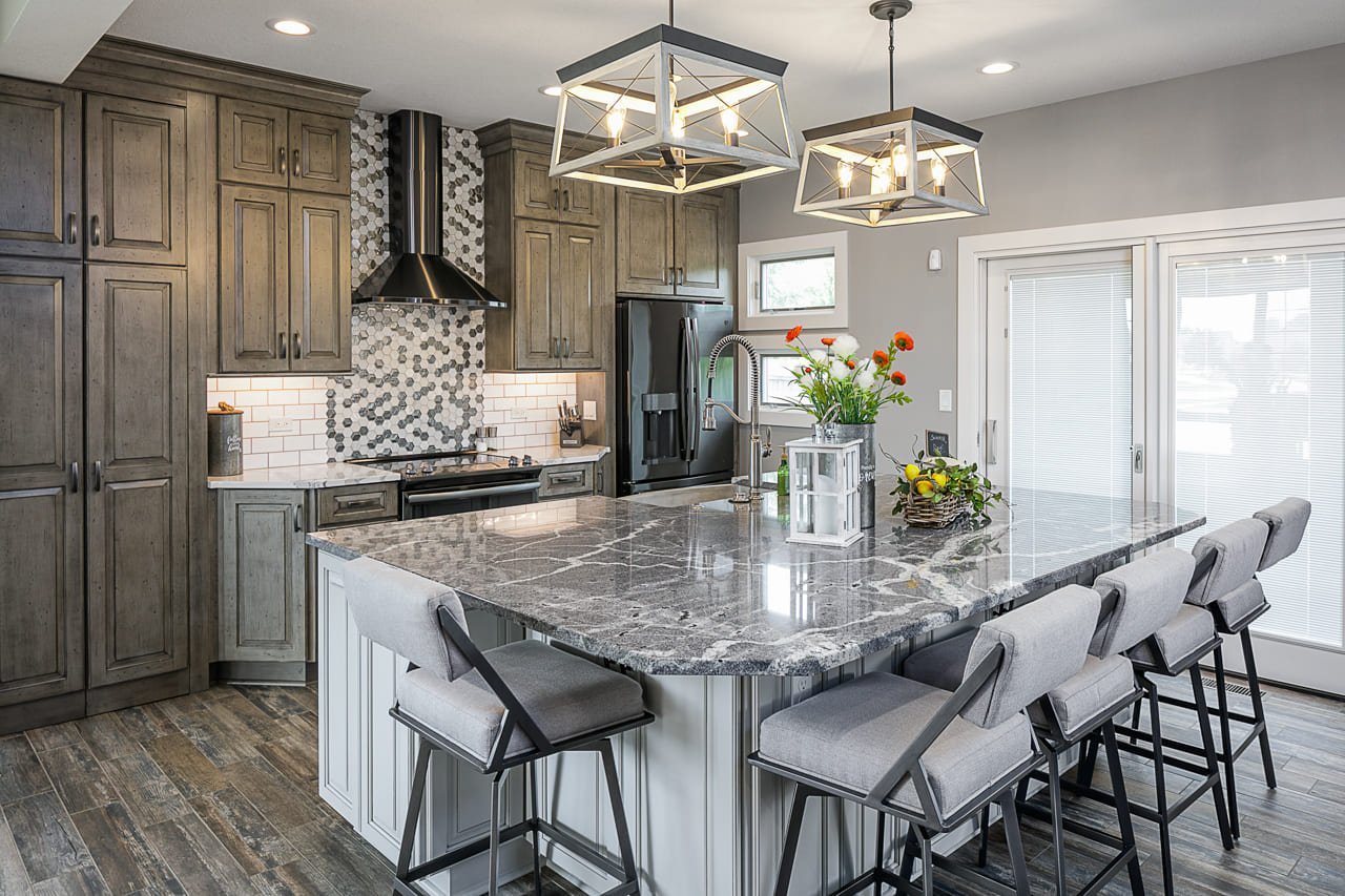 Natural and Grey Kitchen with Gorgeous Stone Eat-in Island and Mosaic Tile Backsplash | Compelling Homes Remodeling + Design