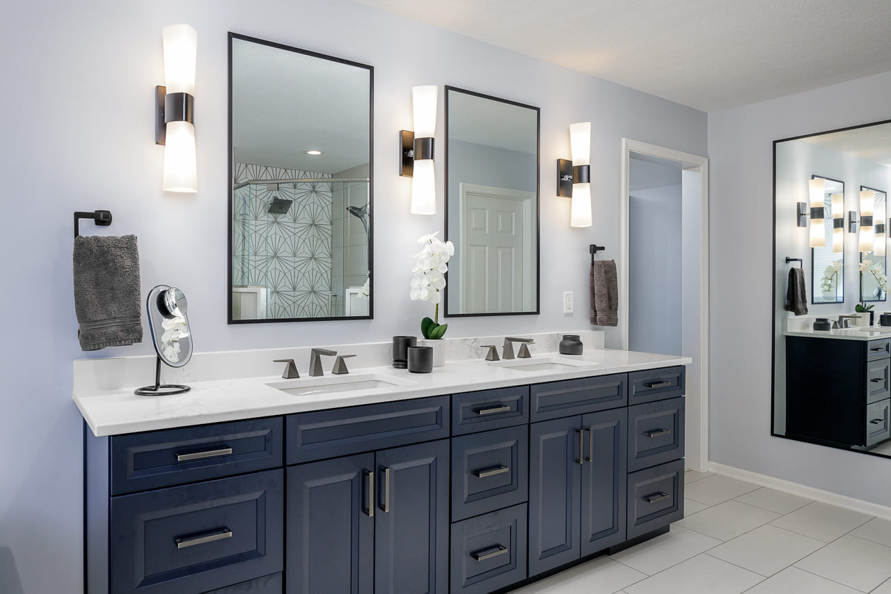 Double Sink Vanity with Dark Blue Cabinets | Compelling Homes