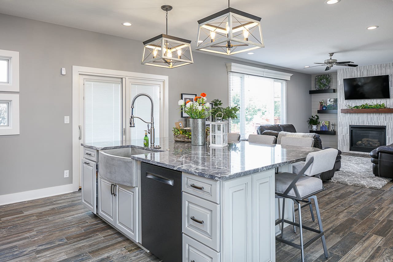 Kitchen island featuring large farmhouse sink and island seating